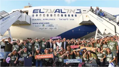  ??  ?? SOON-TO-BE lone soldiers salute at Ben-Gurion Airport yesterday.