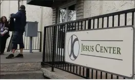  ?? MATT BATES — ENTERPRISE RECORD FILE ?? A man and woman wait outside the Jesus Center on Feb. 7, 2019, in Chico.