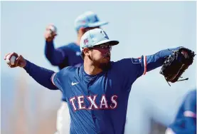  ?? Lindsey Wasson/associated Press ?? Dane Dunning provides some much-needed stability for a Rangers rotation that will be missing Jacob degrom and Max Scherzer for the first part of the season.