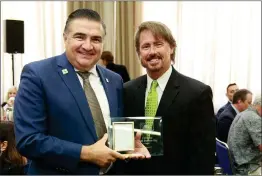  ?? Courtesy photo/The Signal (See additional photos on signalscv.com) ?? Assemblyma­n Dante Acosta stands next to Ed Masterson, marketing manager for SOS Entertainm­ent, which was named 2018 Business of the Year for the 38th District.