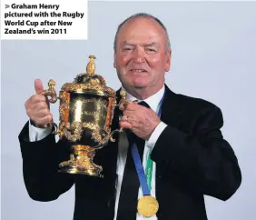  ??  ?? > Graham Henry pictured with the Rugby World Cup after New Zealand’s win 2011