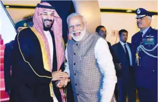  ??  ?? Saudi Crown Prince Mohammed bin Salman with Prime Minister Narendra Modi