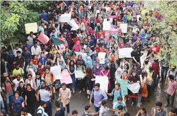  ?? Reuters ?? Thousands of students join in a protest over a recent traffic accident that killed a boy and a girl in Dhaka, Bangladesh, on Sunday.
