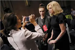  ?? Win McNamee/Pool/Abaca Press/TNS ?? ■ Rep. Carolyn Maloney, D-N.Y., right, and actress and sexual assault survivor Alyssa Milano are interviewe­d September 27 in the hearing room where Christine Blasey Ford testified before the Senate Judiciary Committee in the Dirksen Senate Office Building on Capitol Hill in Washington, D.C.