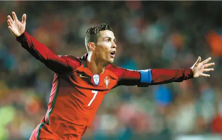  ?? EPA-Yonhap ?? Portugal’s player Cristiano Ronaldo celebrates after scoring a goal during their 2018 FIFA World Cup Russia Group B qualifying soccer match against Hungary at Luz Stadium in Lisbon, Portugal, Saturday.