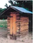  ??  ?? An outhouse in Chloride, N.M., is uniquely built with the wooden planks stacked horizontal­ly rather than nailed to a frame vertically.