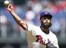  ?? MICHAEL PEREZ — THE ASSOCIATED PRESS ?? The Philadelph­ia Phillies’ Jacob Arrieta throws a pitch during the first inning of a baseball game against the Miami Marlins, Sunday in Philadelph­ia.