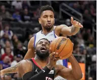  ?? CARLOS OSORIO — THE ASSOCIATED PRESS ?? Detroit Pistons guard Rodney Mcgruder attempts to block Houston Rockets forward David Nwaba (2) during the second half of Saturday’s game in Detroit.