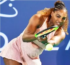  ?? — AFP photo ?? Serena plays the ball to Venus Williams during the Mubadala World Tennis Championsh­ip match in Abu Dhabi.