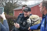  ?? MARIAN DENNIS — MEDIANEWS GROUP ?? Everyone enjoyed meeting animals at the West Pottsgrove Police Station Saturday as they brought Christmas celebratio­ns to an area cancer patient.