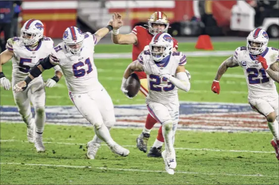  ?? Ralph Freso / Getty Images ?? Micah Hyde (23) and the rest of the Buffalo defense has showed marked improvemen­t since a difficult loss to Arizona. In the first 10 games of the season, Buffalo was giving up 27.3 points per game. In the past eight games, the Bills are undefeated and are giving up 17.1 points per game.