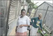  ?? JOAO SILVA — THE NEW YORK TIMES ?? Sizakele Mathe, left, a treatment adherence counselor, with Silendile Mdunge in the township of Ntuzuma, north of Durban, South Africa, on Nov. 14.