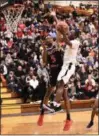  ?? PAUL DICICCO — FOR THE NEWS-HERALD ?? Euclid’s Garvin Clarke goes to the basket against VASJ’s Latrace Jackson on Feb. 9.