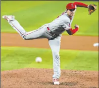  ?? Lynne Sladky The Associated Press ?? Shohei Ohtani held Miami to one unearned run on two hits while striking out 10 in seven innings and hit a two-run single in the Angels’ 5-2 victory Wednesday at Loandepot Park.