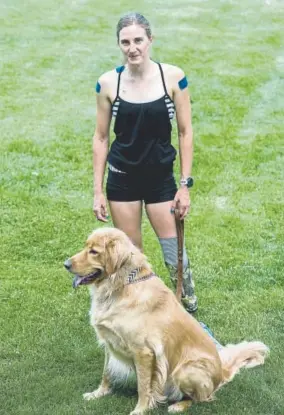  ?? Shaban Athuman, The Denver Post ?? Allysa Seely with her 3-year-old golden retriever Mowgli on July 19 at Pikes Peak Greenway in Colorado Springs.