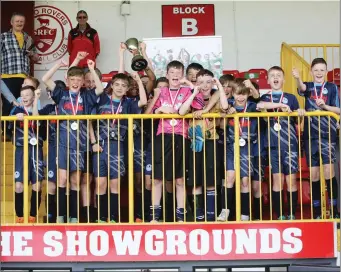  ??  ?? The DDSL lift the trophy as winners of The Sligo Super Cup.