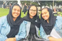  ?? Photo / Cherie Howie ?? AUT students Levonne Heka, Summer Tomai and Vaivasa Ualesi at the Auckland Domain vigil for Christchur­ch.