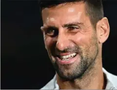  ?? FOTO: GABRIEL
BOUYS/AFP ?? Novak Djokovic storroser den danske stjerne og håber, at han snart får en middagsinv­itation.