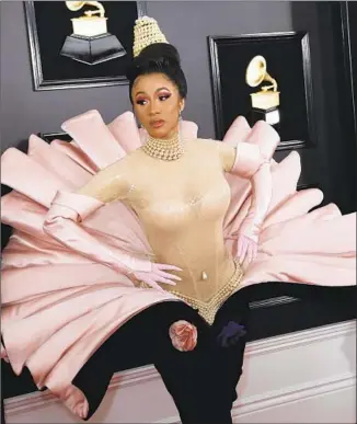  ?? Marcus Yam Los Angeles Times ?? CARDI B arrives at the 61st Grammy Awards on Sunday in a vintage gown by Thierry Mugler.