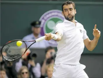  ?? Alastair Grant/Associated Press ?? Croatia's Marin Cilic reached his first Wimbledon final by defeating American Sam Querrey in four sets, 6-7 (6), 6-4, 7-6 (3), 7-5. He recorded 25 aces in the match.