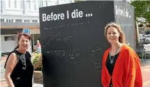  ?? KRIS BOULT/STUFF ?? Ha¯ wera Bizlink co-ordinators Cara Hayes and Nikki Watson were among the first to put their mark on the new ‘Before I die’ cube in the town square.