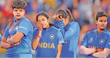  ?? AP ?? (From left) Shafali Verma, Jemimah Rodrigues, Radha Yadav and Deepti Sharma look dejected after India’s loss to Australia in the T20 World Cup in Melbourne on Sunday. —