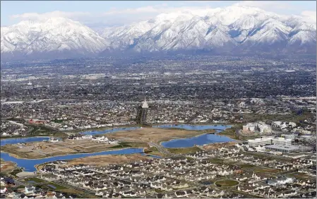  ?? RICK BOWMER — THE ASSOCIATED PRESS ?? Homes in suburban Salt Lake City are shown in April 2019. According to a new study released Monday by the U.S. Census Bureau, by age 26more than twothirds of millennial­s lived in the same general area where they grew up, 80% had moved less than 100miles away and 90% resided less than 500miles away.