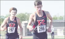  ?? GEORGE POHLY — THE MACOMB DAILY ?? Zander Cobb, right, and Jack Kelke lead Romeo to first place in the MAC Red jamboree at Romeo High on Friday.