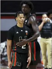  ?? MATT GENTRY — THE ROANOKE TIMES VIA AP ?? Miami’s Isaiah Wong, left, and Nysier Brooks react after Wong missed a 3-point shot in the final moments of a game against Virginia Tech Tuesday. Despite 16 points form Wong, Virginia Tech won 80-78.