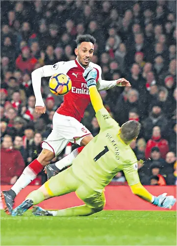  ??  ?? Off and running: Arsenal debutant Pierre-Emerick Aubameyang scores his team’s fourth goal in the rout of Everton at the Emirates