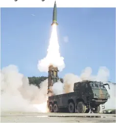  ?? — AFP photo ?? This handout photo provided by South Korean Defence Ministry in Seoul shows South Korea’s Hyunmu-2 Missile System firing a tactical ballistic missile into the East Sea from an undisclose­d location on South Korea’s east coast during a South Korea-US...