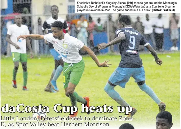  ?? (Photos: Paul Reid) ?? Knockalva Technical’s Kingsley Alcock (left) tries to get around the Manning’s School’s Devrol Wiggan in Monday’s ISSA/WATA dacosta Cup Zone D game played in Savanna-la-mar. The game ended in a 1-1 draw.