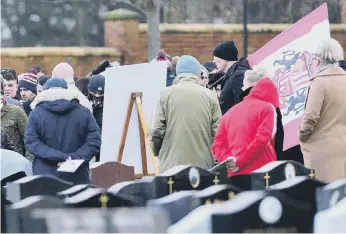  ??  ?? Family and friends gather at Leon’s funeral. Picture by Frank Reid