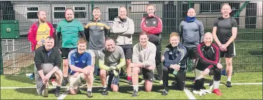  ?? ?? SET FOR ACTION - The Dads and Lads group in Glenville last week.