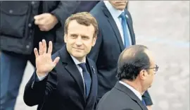  ?? Jeff J Mitchell Getty Images ?? FRENCH PRESIDENT-ELECT Emmanuel Macron, with outgoing President Francois Hollande in Paris, was able to channel anti-establishm­ent sentiment.
