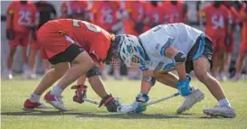  ?? KARL MERTON FERRON/BALTIMORE SUN ?? Maryland’s Luke Wierman, left, and Johns Hopkins’ Matt Narewski prepare for a faceoff during Thursday’s Big Ten Tournament semifinal at Homewood Field. The Terps earned the No. 4 seed while the Blue Jays are the No. 6 seed for the NCAA Tournament.