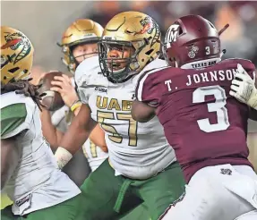  ?? JOSEPH CALOMENI/MARINMEDIA.ORG VIA AP ?? UAB senior Justice Powers (57) was a first-team all-Conference USA player at right offensive tackle.