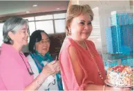  ?? BIRTHDAYS. On the lighter side, January birthday celebrants blow their cake candles: From left are Terry Manguerra, Angie Escaño and Elsa Basubas. ??