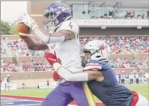  ?? Daniel Sangjib Min / Richmond Times-dispatch via AP ?? Albany receiver Juwan Green, left, hauls in a TD pass against Richmond on Oct. 5. Green is tied for second with teammate Jerah Reeves in the league with 46 receptions. The pair have also combined for a Caa-best 12 touchdowns.