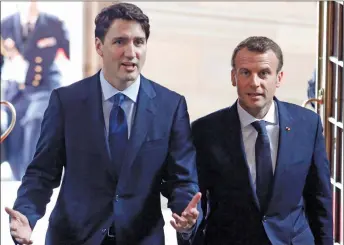  ?? CP PHOTO ?? Prime Minister Justin Trudeau and French President Emmanuel Macron are shown at Parliament Hill in Ottawa.