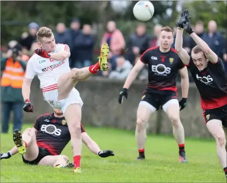  ??  ?? Louth’s Gerard McSorley fires just wide of the posts during Sunday’s game against Down.