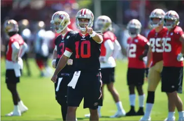  ?? AP PHOTO BY BEN MARGOT ?? San Francisco 49ers quarterbac­k Jimmy Garoppolo (10) gestures during NFL football practice at the team’s headquarte­rs Thursday, July 26 in Santa Clara, Calif.