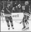  ?? Associated Press ?? Rangers goaltender Jonathan Quick (right) celebrates with Erik Gustafsson (left) after defeating the Devils, Monday, in New York.