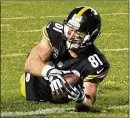  ?? DON WRIGHT / AP ?? Steelers tight end Jesse James stretches to get the ball into the end zone Sunday against the Patriots, but the play was ruled an incomplete pass.