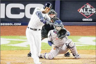  ?? (AP) ?? New York Yankees’ Aaron Hicks connects for a three-run home run against the Houston Astros during the first inning of Game 5 of baseball’s American League Championsh­ip Series on Oct 18 in New York.