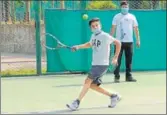  ??  ?? A masked player undergoing training at the Chandigarh Lawn Tennis Associatio­n in Sector 10, Chandigarh, on Saturday. The complex reopened after two months. KESHAV SINGH/HT