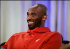  ?? AP Photo/Matt Rourke ?? In this 2019 file photo, former Los Angeles Lakers NBA basketball player Kobe Bryant listens to a question as he meets with students at Andrew Hamilton School in Philadelph­ia.