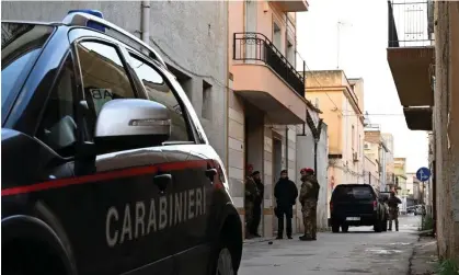  ?? ?? Carabinier­i police officers and military men prevent access to a house used as a mafia hideout in Campobello di Mazara, Sicily, on 19 January. Photograph: Miguel Medina/AFP/Getty Images