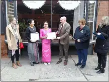  ??  ?? May Dongkhan, in pink, receives citations from the city and county at the ribbon-cutting for her restaurant, Lime Leaf Thai Bistro.