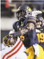  ?? Bruce Newman / Associated Press ?? Cal safety Jaylinn Hawkins is averaging 5.5 tackles per game, with one intercepti­on (above) against Mississipp­i.